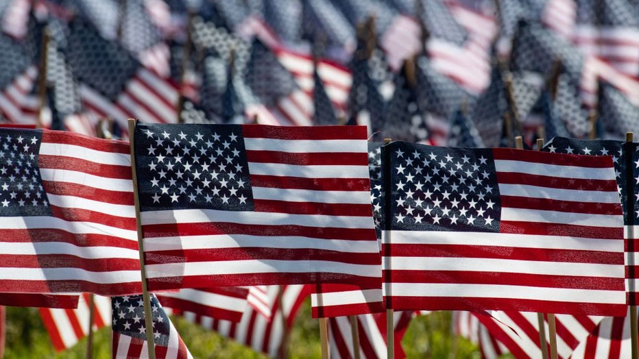 FILE - US flags are set next to the Soldiers and Sailors Monument by the Massachusetts Military Heroes Fund for Memorial Day, in Boston, Massachusetts, on May 26, 2023. (Photo by JOSEPH PREZIOSO/AFP via Getty Images)