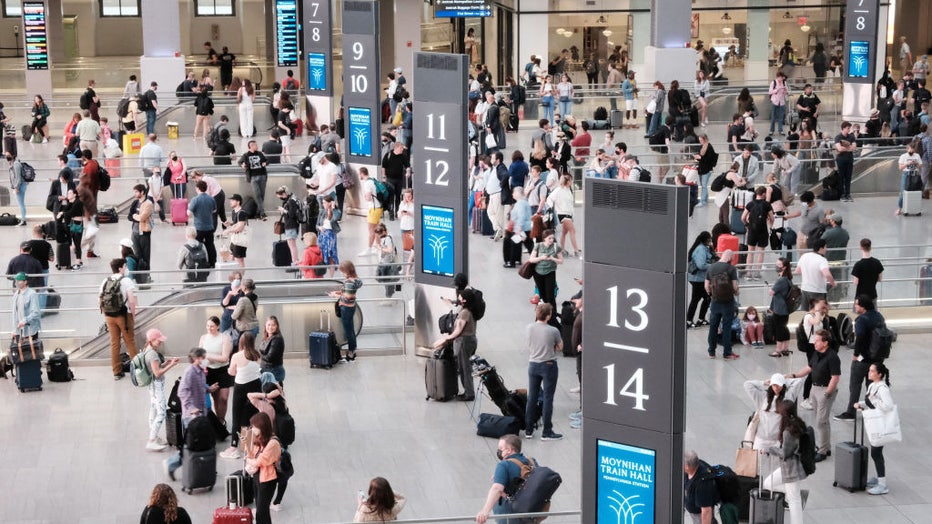 FILE - People wait to board trains at the Moynihan Train Hall in Manhattan at the start of the Memorial Day weekend on May 27, 2022 in New York City. (Photo by Spencer Platt/Getty Images)