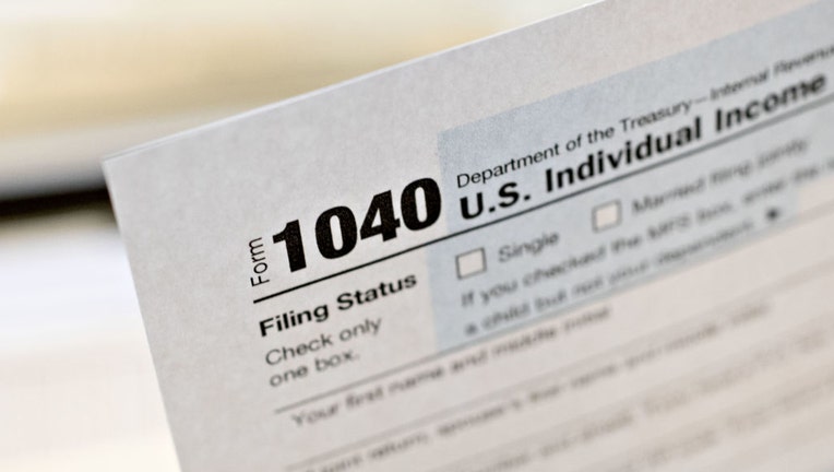 FILE - A U.S. Department of the Treasury Internal Revenue Service (IRS) 1040 Individual Income Tax form for the 2019 tax year is arranged for a photograph in Tiskilwa, Illinois, U.S., on March 20, 2020. Photographer: Daniel Acker/Bloomberg via Getty Images