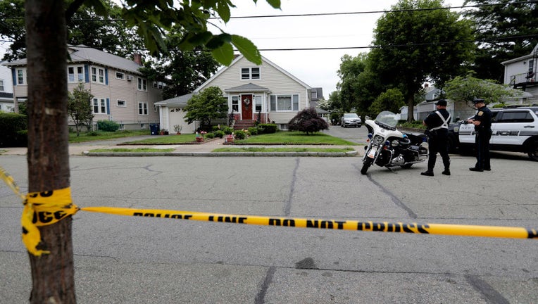 Newton police maintain a presence at 49 Broadway Street, where three elderly people were found murdered, in a photo dated June 26, 2023, in Newton, Massachusetts. (Photo by Pat Greenhouse/The Boston Globe via Getty Images)