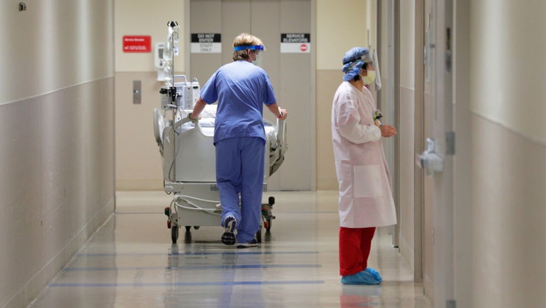 FILE - A patient is taken from the dialysis unit after recieving treatment at Regional Medical Center in San Jose, Calif., on July 22, 2020. (Photo By Carlos Avila Gonzalez/The San Francisco Chronicle via Getty Images)