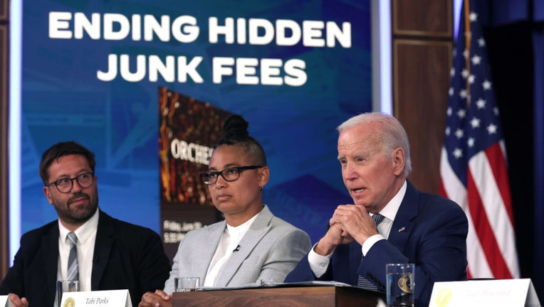 (R-L) U.S. President Joe Biden delivers remarks on protecting consumers from hidden junk fees as CEO of xBk Tobi Parks and CEO of DICE Phil Hutcheon listen during an event at the South Court Auditorium at Eisenhower Executive Office Building on June 15, 2023 in Washington, DC. (Photo by Alex Wong/Getty Images)