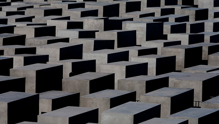 FILE - Holocaust memorial and the 2,711 tombs by architect Peter Eisenman, in Mitte area of Berlin. (Photo by michel Setboun/Corbis via Getty Images)