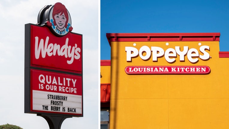 FILE IMAGES - The Wendys logo is seen on a sign outside a restaurant, and the exterior of Popeyes Louisiana Kitchen restaurant is pictured. Photos by Paul Weaver/SOPA Images/LightRocket via Getty Images / Michael Siluk/UCG/Universal Images Group via Getty Images)