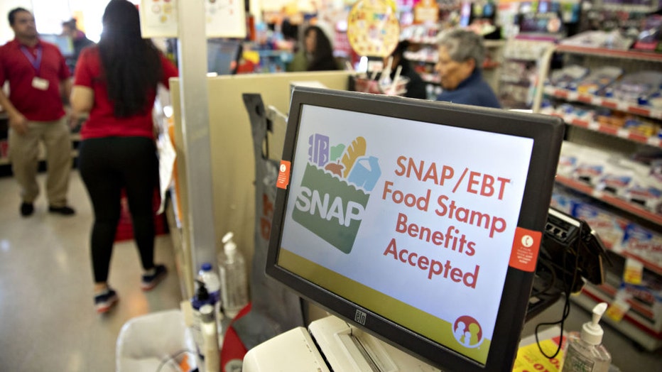 FILE - "SNAP/EBT Food Stamp Benefits Accepted" is displayed on a screen inside a Family Dollar Stores Inc. store in Chicago, Illinois, U.S., on March 3, 2020. Photographer: Daniel Acker/Bloomberg via Getty Images