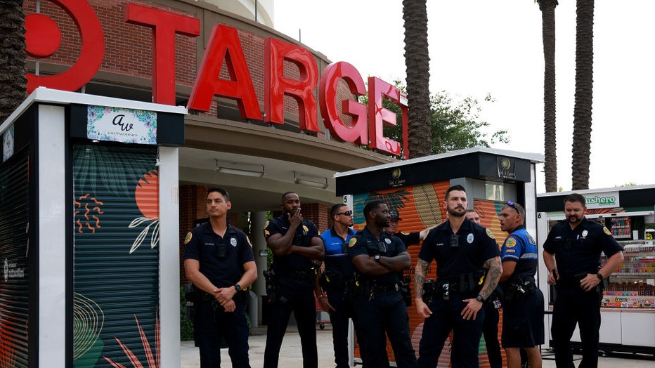 FILE - City of Miami police officers keep an eye on protesters outside of a Target store on June 1, 2023, in Miami, Florida. (Photo by Joe Raedle/Getty Images)