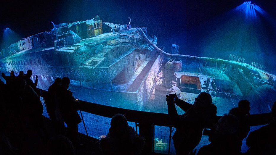 FILE - People look at a large-scale 360 degree panorama presentation of the Titanic shipwreck by artist Yadegar Asisi during a press preview on Jan. 27, 2017, in Leipzig, Germany. (Photo by Jens Schlueter/Getty Images)