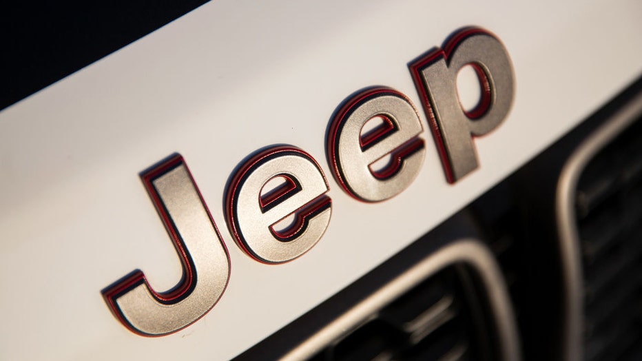 FILE - A logo sits on the bonnet of a Jeep Grand Cherokee SUV in a file image dated Aug. 23, 2017. Photographer: Alessia Pierdomenico/Bloomberg via Getty Images