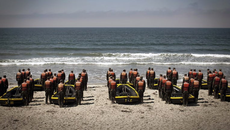 FILE - A group of Navy Seal trainees in August of 2010 during Hell Week at a beach in Coronado, California. (Photo by Charles Ommanney/Getty Images)