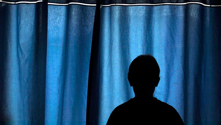 FILE - The silhouetted shape of a boy is pictured in a file image. (Photo by: Universal Education/Universal Images Group via Getty Images)