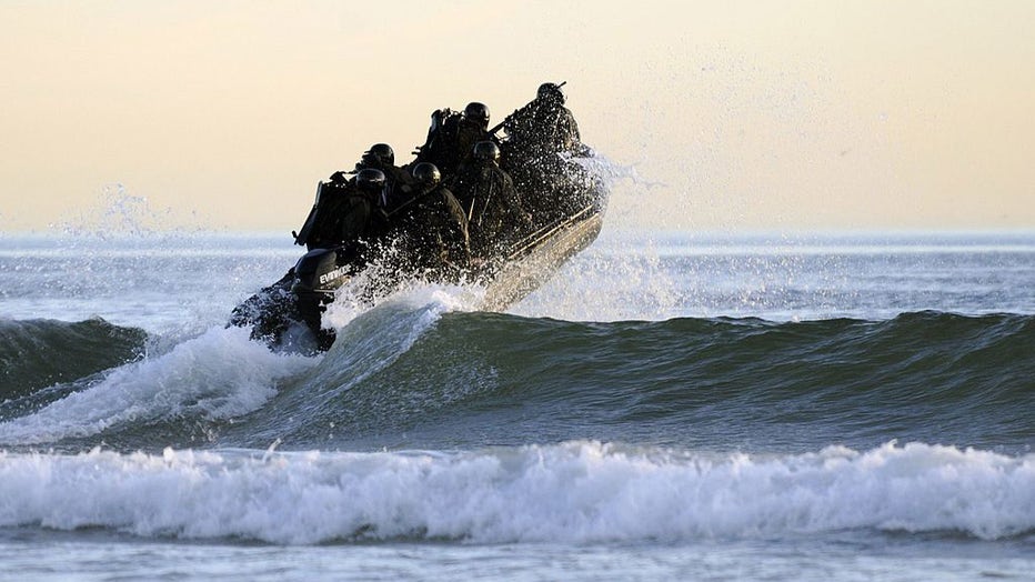 FILE - In this handout provided by the U.S. Navy, Students in Sea Air and Land (SEAL) qualification training navigate the surf off the cost of Coronado during a maritime operations training exercise Oct. 28, 2010, in Coronado, California. (Photo by Blake Midnight/US Navy via Getty Images)