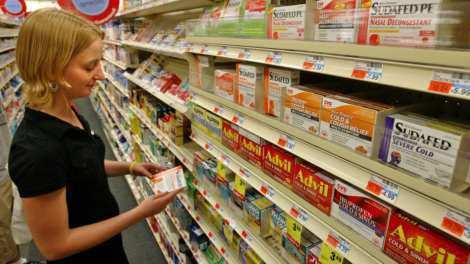 A customer looks at a package of Sudafed in a CVS store. (Matt Stone/MediaNews Group/Boston Herald via Getty Images / Getty Images)