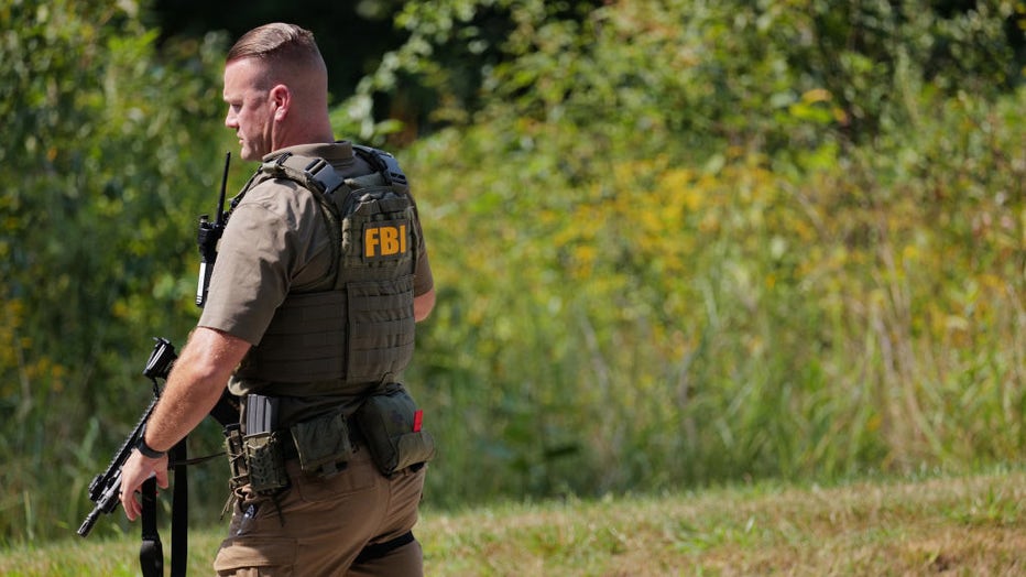 FILE - An FBI agent joins police on the perimeter of a search zone for an escaped prisoner on September 8, 2023, in Kennett Square, Pennsylvania. (Photo by Spencer Platt/Getty Images)