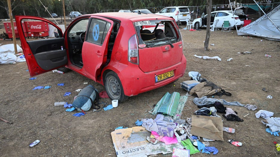 RE'IM, ISRAEL - OCTOBER 12: Destroyed cars and belongings left at the Supernova Music Festival site where hundreds were killed and dozens taken by Hamas militants near the border with Gaza on Oct. 12, 2023, in Kibbutz Re'im, Israel. (Photo by Leon Neal/Getty Images)
