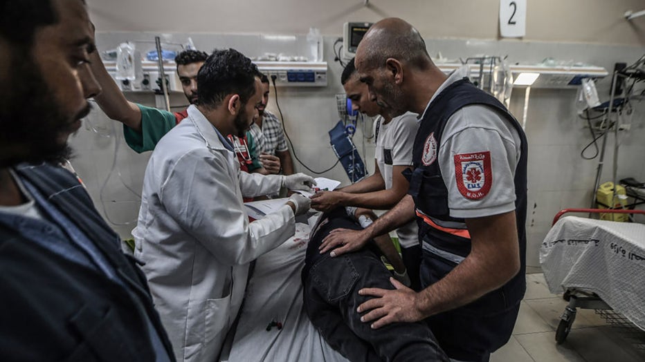 A citizen receives first aid at a hospital in Khan Yunis, injured in the Israeli airstrikes that continued on the 10th day, in Gaza on Oct. 16, 2023. (Photo by Abed Zagout/Anadolu via Getty Images)