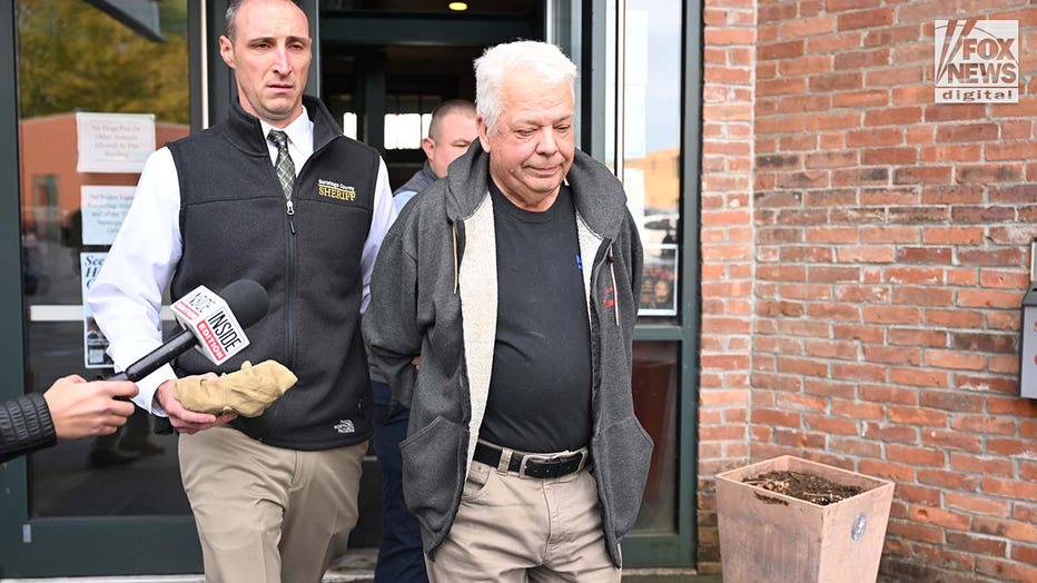 Michael Arnold is escorted out of the Saratoga Town Court in Schuylerville, New York, on Oct. 10, 2023. Arnold is suspected of flying his single-engine plane over Cassie Wilusz's home and posting threatening messages online. (Hans Pennink for Fox News Digital)
