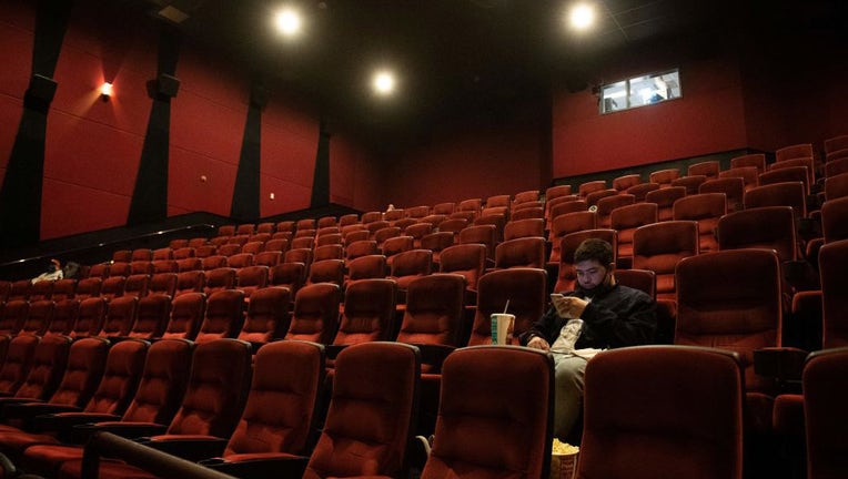 FILE - Moviegoers wait for the movie to start at the AMC Burbank theatre on reopening day in Burbank, California, March 15, 2021. (Photo by VALERIE MACON/AFP via Getty Images)