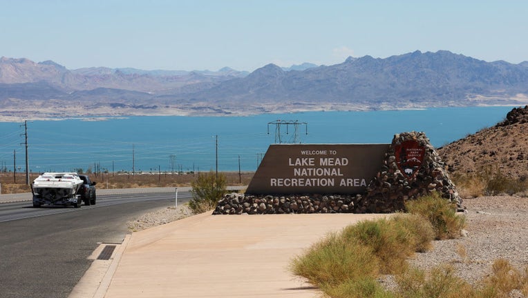 FILE - A vehicle towing a boat drives past a sign welcoming visitors to the Lake Mead National Recreation Area on July 1, 2022 in the Lake Mead National Recreation Area, Nevada. (Photo by Ethan Miller/Getty Images)