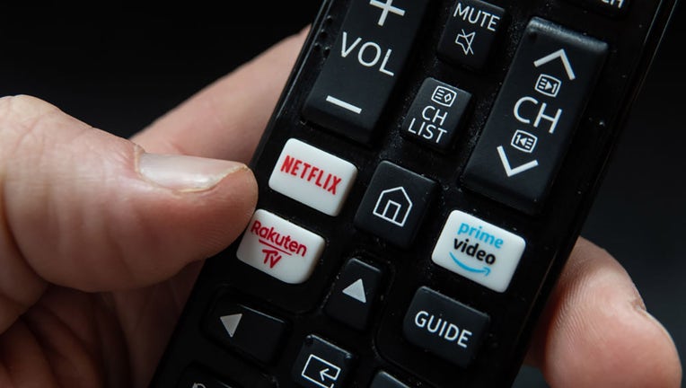 FILE - In this photo illustration, a TV remote control with Netflix and Amazon Prime Video streaming platform buttons is seen on April 4, 2023. (Photo by Matt Cardy/Getty Images)