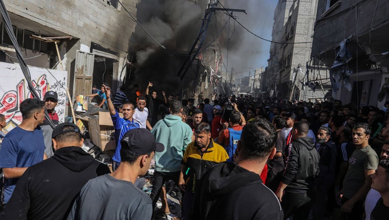 Residents try to save survivors amid destruction caused by Israeli airstrikes on Shabura refugee camp in Rafah, Gaza on November 17, 2023. (Photo by Abed Rahim Khatib/Anadolu via Getty Images)