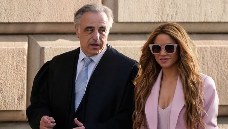 Colombian singer Shakira arrives with her lawyer Pau Molins (L) at the High Court of Justice of Catalonia for her trial on tax fraud, in Barcelona on Nov. 20, 2023. (Photo by PAU BARRENA/AFP via Getty Images)