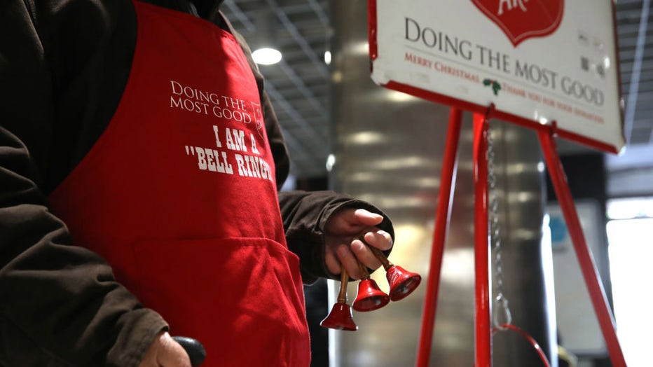 FILE - A Salvation Army volunteer bell ringer stands as he solicits donations at the Powell Street Bay Area Rapid Transit (BART) station on Dec. 3, 2019, in San Francisco, California. (Photo by Justin Sullivan/Getty Images)