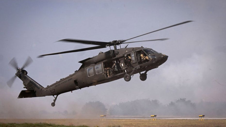 FILE IMAGE - Military personnel of the US Armys 101st Airborne Division take off with a Black Hawk helicopter during a demonstration drill at Mihail Kogalniceanu Airbase near Constanta, Romania on July 30, 2022. (Photo by DANIEL MIHAILESCU/AFP via Getty Images)