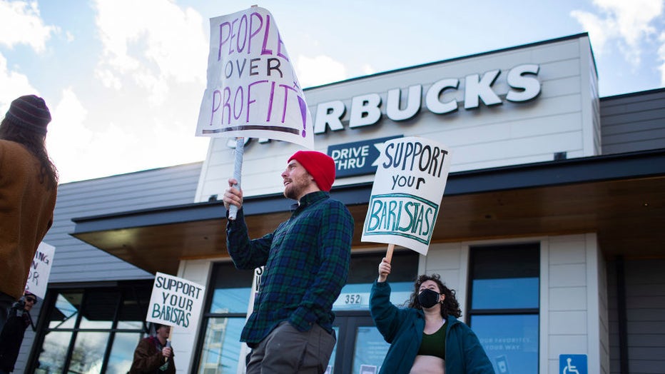 Starbucks workers in Biddeford, Maine, participate in the Red Cup Rebellion, a nationwide strike demanding the company fully staff union stores and bargain in good faith, on Nov. 16, 2023. The one-day strike was planned to coincide with the company's Red Cup Day, the annual event where customers receive free Starbucks cups with certain purchases. (Staff photo by Derek Davis/Portland Press Herald via Getty Images)