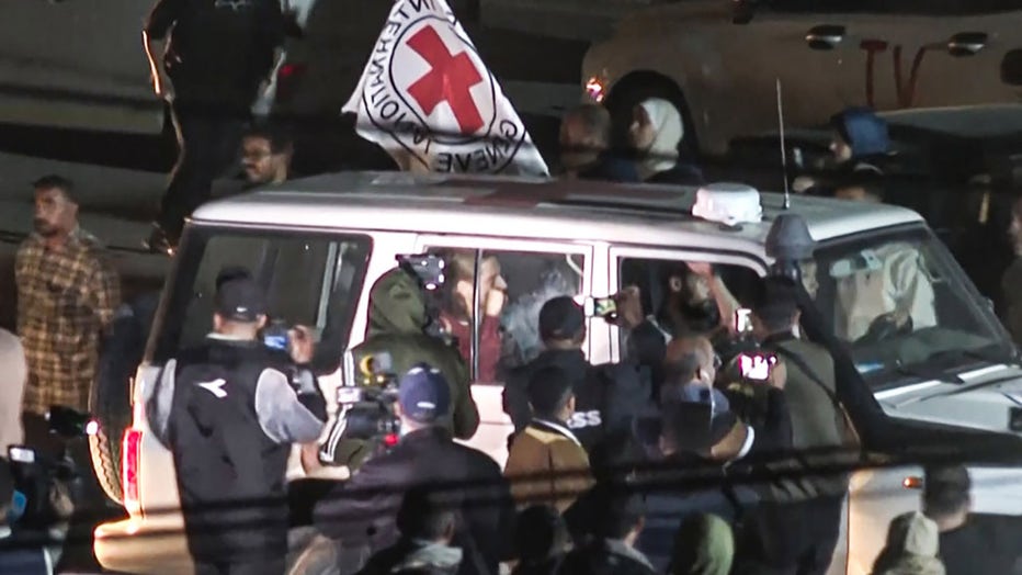 This image grab taken from AFPTV video footage on Nov. 26, 2023, shows an International Red Cross vehicle carrying Israeli Russian hostage Ron Krivoy (C) released by Hamas driving towards the Rafah border point with Egypt ahead of a transfer to Israel. (Photo by BELAL AL SABBAGH/AFPTV/AFP via Getty Images)