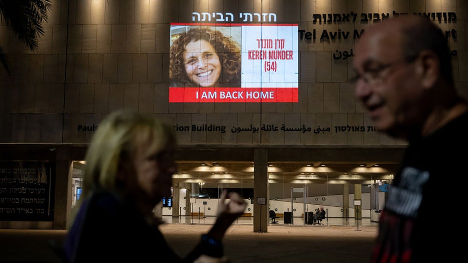 The face of the newly released hostage, Keren Munder, 54, is projected onto the wall outside The Museum of Modern Art known as the 'The Hostages and Missing Square' on Nov. 24, 2023, in Tel Aviv, Israel. (Photo by Alexi J. Rosenfeld/Getty Images)