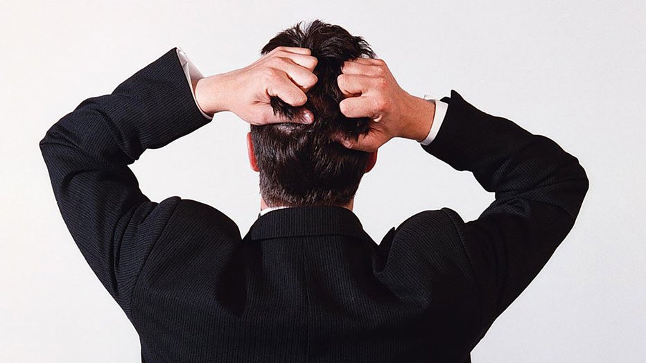 FILE - A business man tearing his hair out in frustration. (Photo by Fairfax Media via Getty Images via Getty Images)