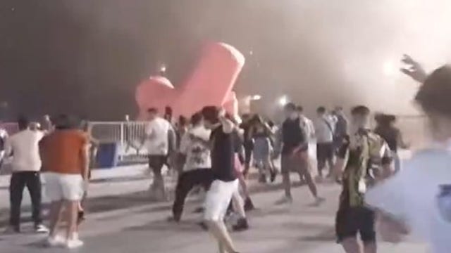 Watch: Buenos Aires music festival descends into chaos as storm rips apart stage