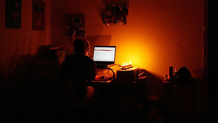 FILE - A woman works on a computer at home in 2006. (Photo by Fairfax Media via Getty Images via Getty Images)