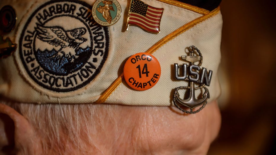 FILE - Howard Bender, who died in 2018, shows off his Orange County Chapter of the Pearl Harbor Survivors Association pin at his Irvine home on Dec. 4, 2017. Bender was aboard the USS Maryland in Pearl Harbor, Hawaii, on Dec. 7, 1941, when he heard the sounds of Japanese planes attacking the U.S. territory. (Photo by Jeff Gritchen/Digital First Media/Orange County Register via Getty Images)
