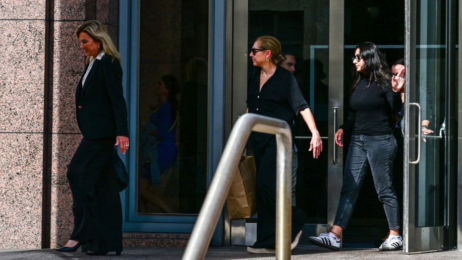 Karla Wittkop, wife of Victor Manuel Rocha (R) and lawyer Jacqueline Arango (L) leave the James L. King Federal Court in Miami, Florida, on December 4, 2023. (Photo by GIORGIO VIERA / AFP) (Photo by GIORGIO VIERA/AFP via Getty Images)
