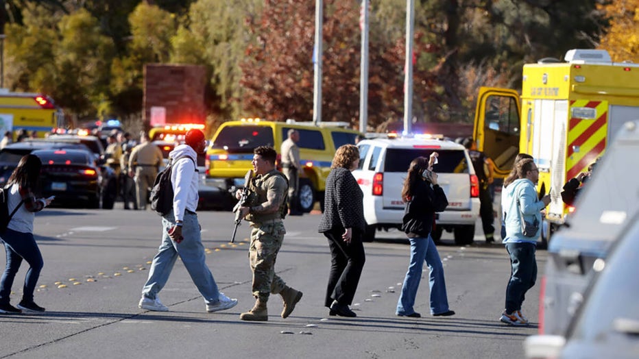 Police evacuate students on Harmon Avenue near Maryland Parkway after a shooting on the UNLV campus in Las Vegas Wednesday, Dec. 6, 2023. (K.M. Cannon/Las Vegas Review-Journal/Tribune News Service via Getty Images)