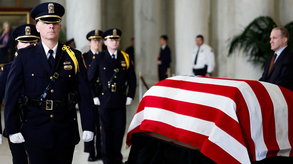 Honor Guard members rotate their positions as the late retired Supreme Court Justice Sandra Day O'Connor lies in repose in the Great Hall of the U.S. Supreme Court on Dec. 18, 2023, in Washington, D.C. O’Connor, the first woman appointed to be a justice on the U.S. Supreme Court, died at the age of 93 on Dec. 1. (Photo by Anna Moneymaker/Getty Images)