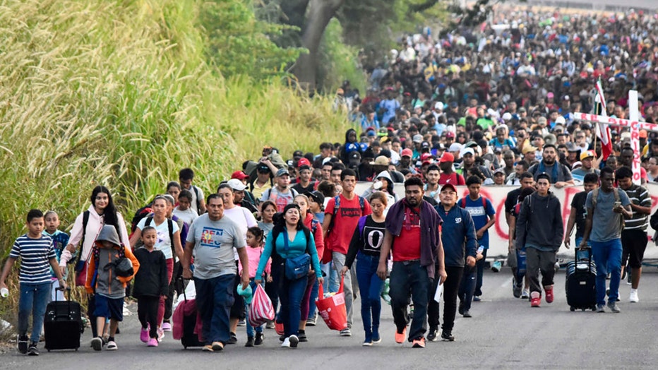 Migrants take part in a caravan towards the border with the United States in Tapachula, Chiapas State, Mexico, on Dec. 24, 2023. (Photo by STR/AFP via Getty Images)