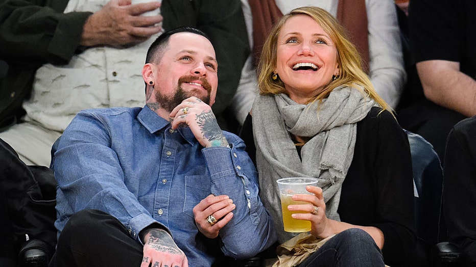 FILE - Benji Madden (L) and Cameron Diaz attend a basketball game between the Washington Wizards and the Los Angeles Lakers at Staples Center on Jan. 27, 2015, in Los Angeles, California. (Photo by Noel Vasquez/GC Images)