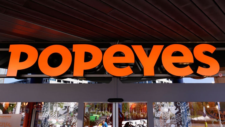 FILE - The Popeyes Louisiana Kitchen Inc logo, also known as Popeyes, the American multinational chain of fried chicken fast food restaurants formed in New Orleans and headquartered in Miami, captured on its Letzipark restaurant on November 13, 2023, in Zrich, Switzerland. (Photo by Joan Cros/NurPhoto via Getty Images)