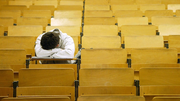 FILE - A student naps in a lecture hall in Berlin, Germany. (Photo by Sean Gallup/Getty Images)