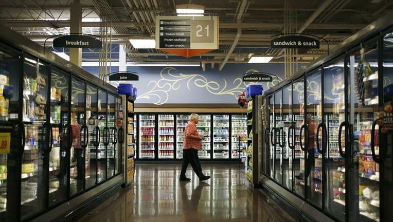 FILE - A customer walks past the frozen food aisle inside a Kroger Co. grocery store in Louisville, Kentucky, on June 14, 2017. Photographer: Luke Sharrett/Bloomberg via Getty Images