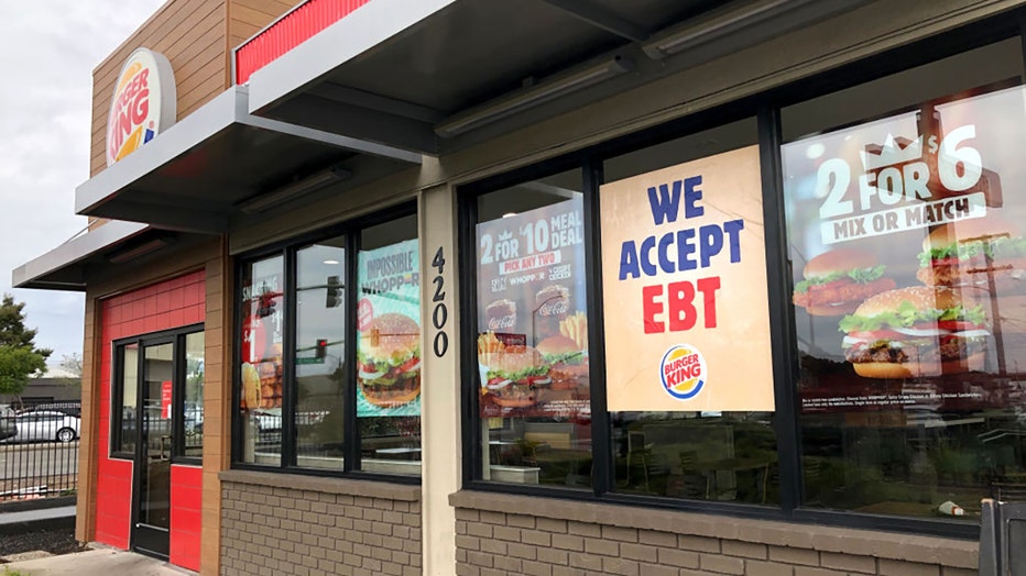 FILE - A sign noting the acceptance of electronic benefit transfer (EBT) cards is displayed at a Burger King restaurant on Dec. 4, 2019, in Oakland, California. (Photo by Justin Sullivan/Getty Images)