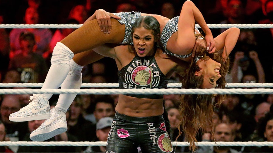 Bianca Belair carries Carmella during WWE Monday Night Raw at the TD Garden on March 6, 2023, in Boston, Massachusetts (Photo by Matt Stone/MediaNews Group/Boston Herald via Getty Images)