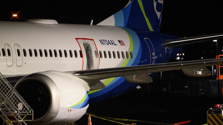 A plastic sheet covers an area of the fuselage of the Alaska Airlines N704AL Boeing 737 MAX 9 aircraft outside a hangar at Portland International Airport on Jan. 8, 2024, in Portland, Oregon. (Photo by Mathieu Lewis-Rolland/Getty Images)