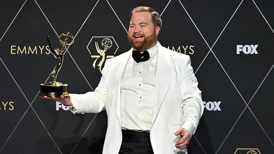 US actor Paul Walter Hauser poses in the press room with the Outstanding Supporting Actor in a Limited/Anthology Series or Movie award for "Black Bird" during the 75th Emmy Awards at the Peacock Theatre at L.A. Live in Los Angeles on January 15, 2024. (Photo by ROBYN BECK/AFP via Getty Images)