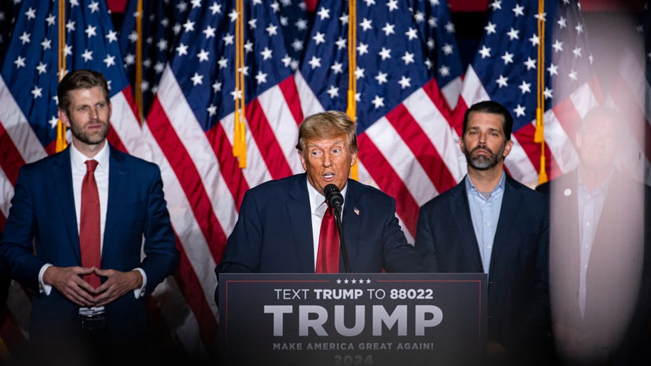 Eric Trump, executive vice president of Trump Organization Inc., from left, former US President Donald Trump, and Donald Trump Jr., executive vice president of development and acquisitions for Trump Organization Inc., at a caucus night watch party in Des Moines, Iowa, US, on Monday, Jan. 15, 2024. Photographer: Al Drago/Bloomberg via Getty Images