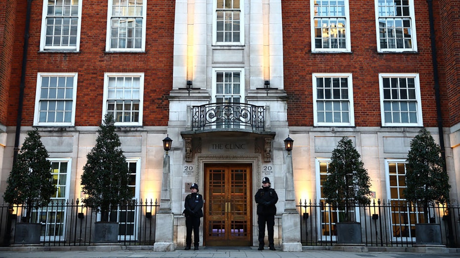 FILE - Police officers stand guard outside the London Clinic in London on Jan. 18, 2024, where Britain's Catherine, Princess of Wales, underwent surgery. Britain's Catherine, Princess of Wales, is facing up to two weeks in hospital after undergoing successful abdominal surgery, Kensington Palace announced on January 17. (Photo by HENRY NICHOLLS/AFP via Getty Images)