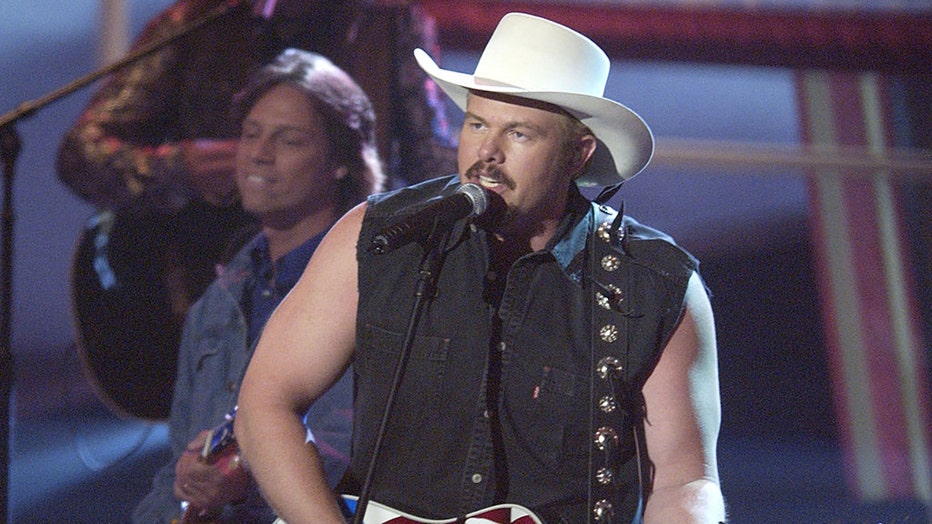 FILE - Toby Keith performs "Courtesy of the Red, White and Blue" at the 37th Academy of Country Music Awards at the Universal Amphitheater on May 22, 2002. (Photo by M. Caulfield/WireImage)