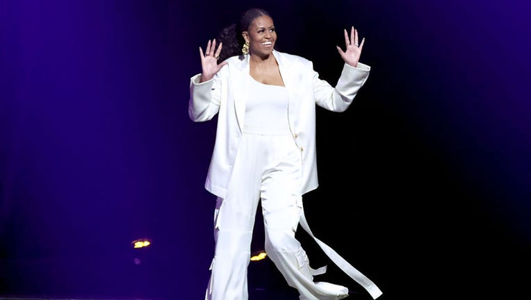 FILE - Michelle Obama walks onstage during The Light We Carry: Overcoming in Uncertain Times - in Conversation with Michelle Obama at YouTube Theater on Dec. 13, 2022, in Inglewood, California. (Photo by Amy Sussman/Getty Images for ABA)